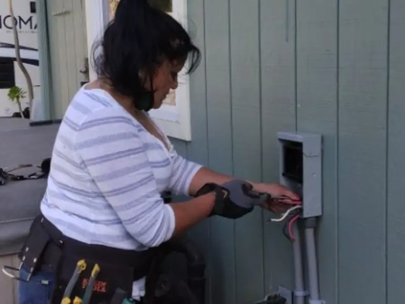 Licensed electrician wiring an exterior subpanel in Gardiner